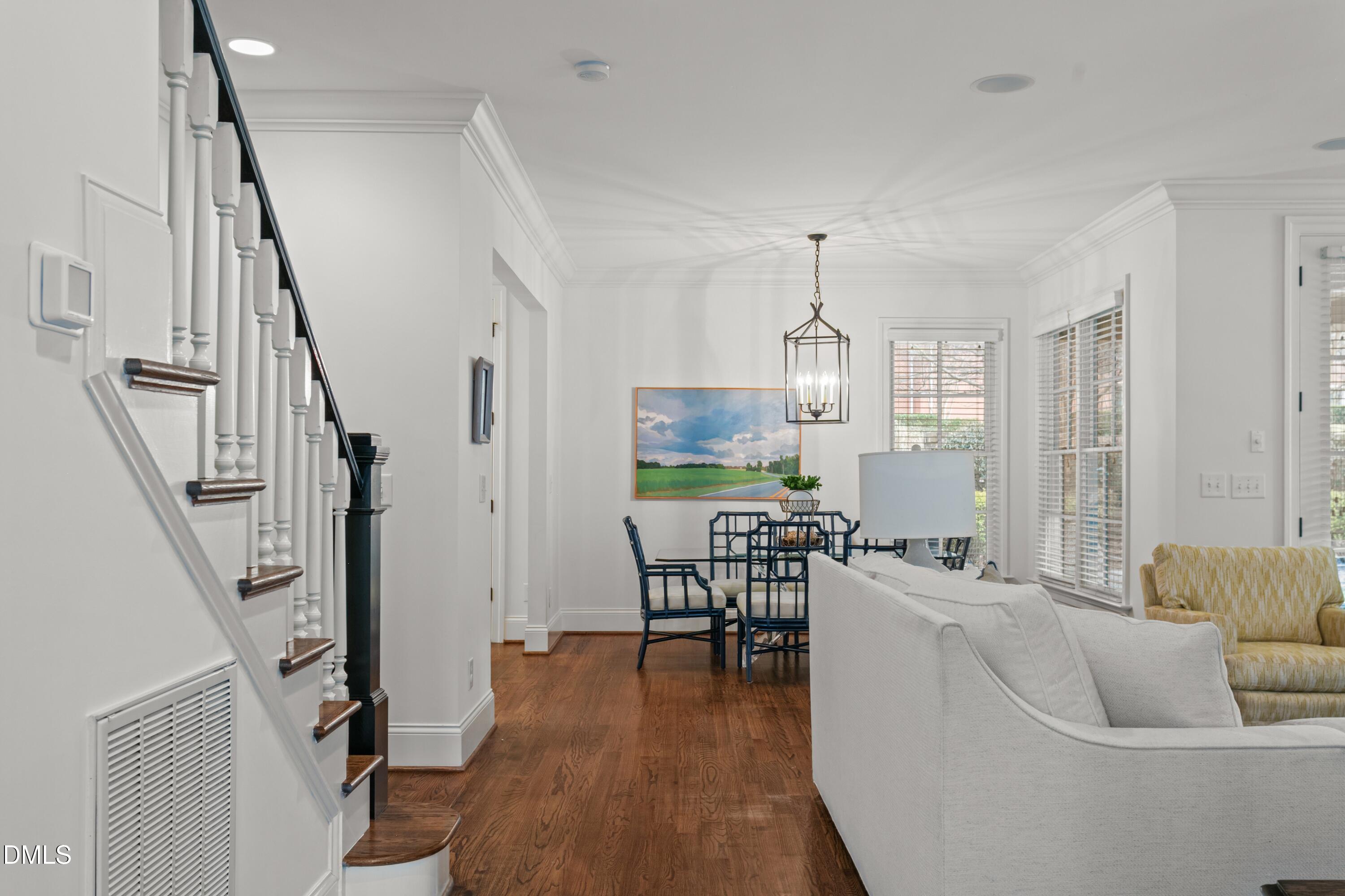514 Wayne Drive Raleigh, NC 27608 - Photo 12 of 53 a living room with fireplace furniture and a wooden floor