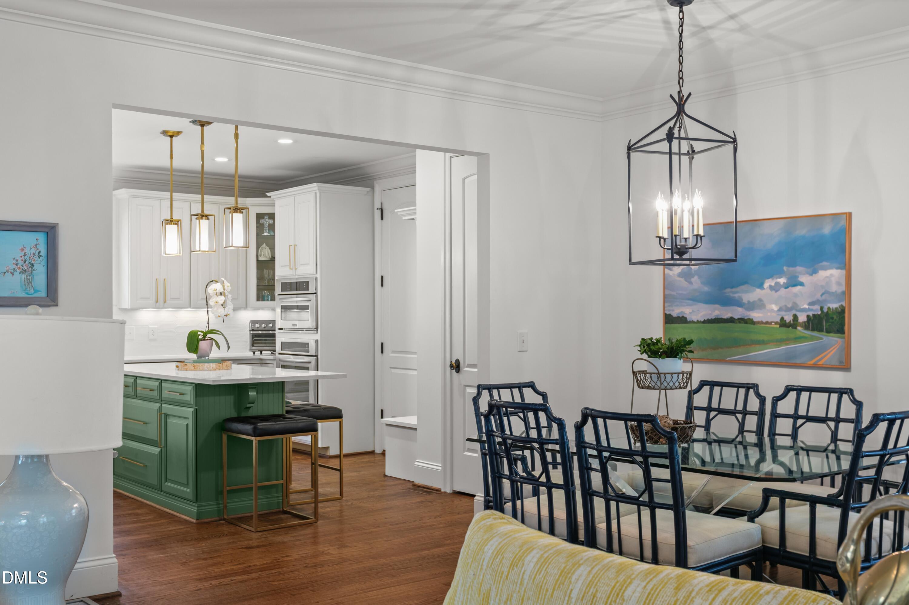 514 Wayne Drive Raleigh, NC 27608 - Photo 13 of 53 a view of a dining room with furniture window and wooden floor