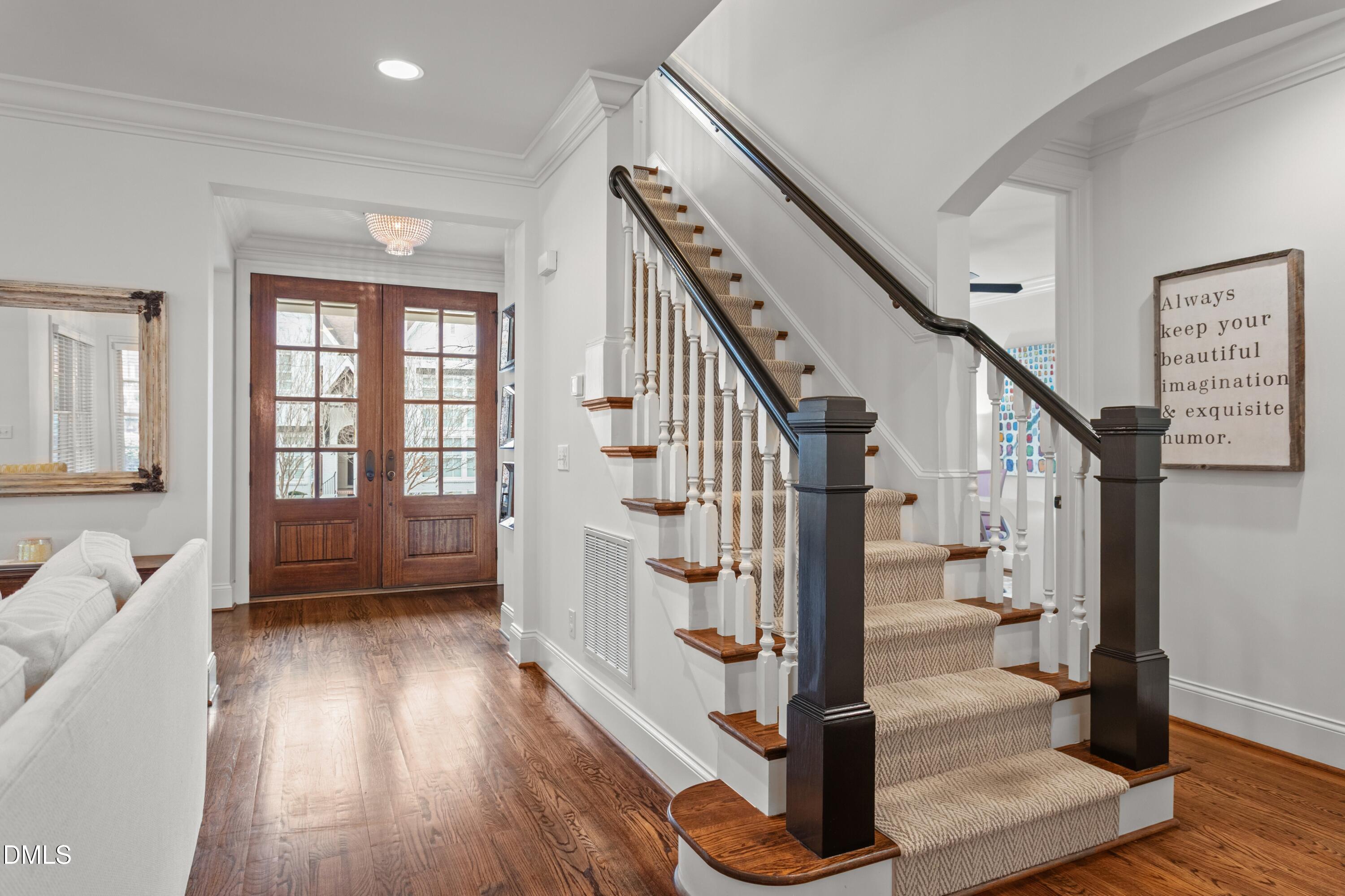 514 Wayne Drive Raleigh, NC 27608 - Photo 20 of 53 a view of entryway and hall with wooden floor