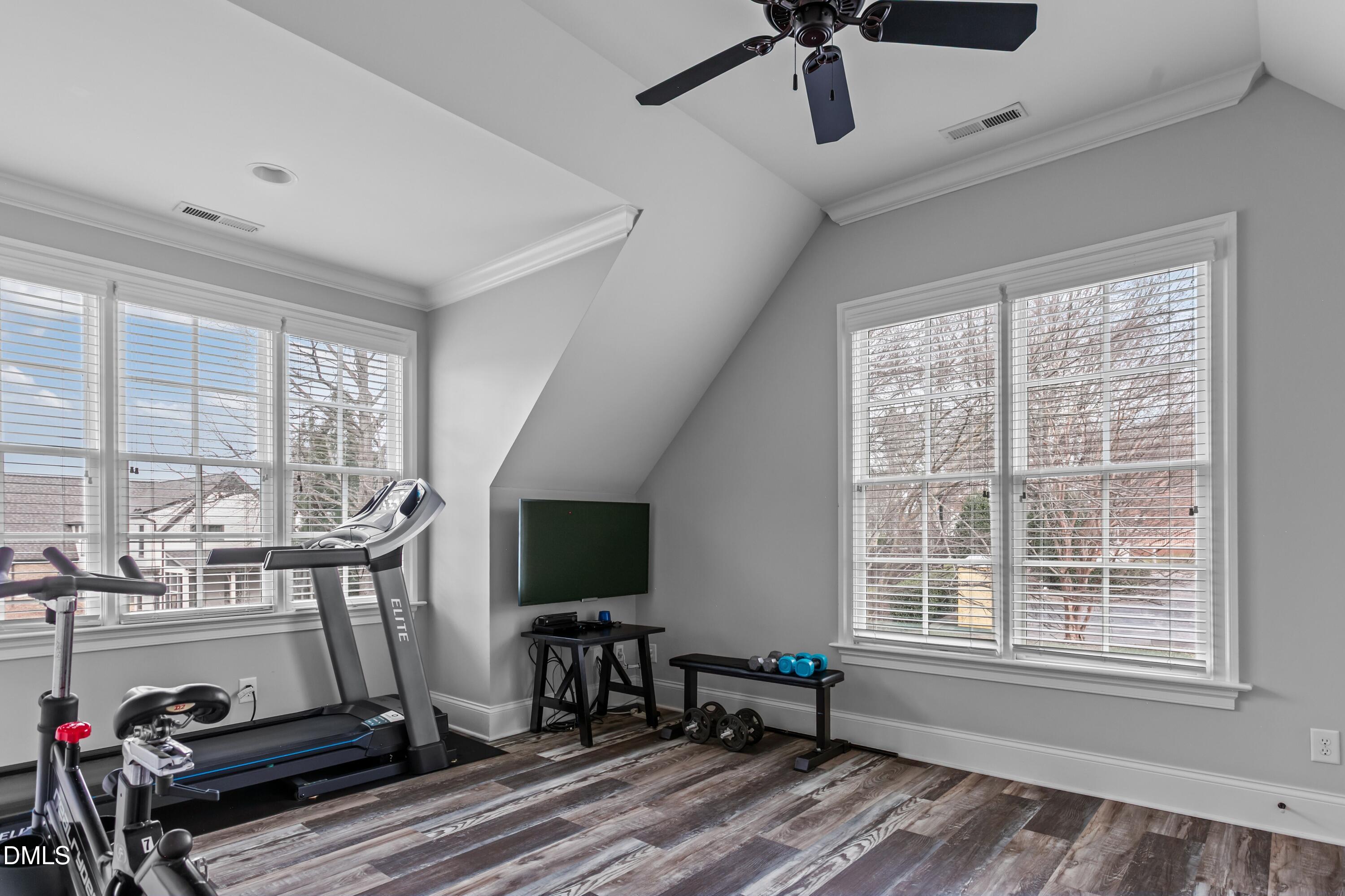 514 Wayne Drive Raleigh, NC 27608 - Photo 29 of 53 a living room with furniture a flat screen tv and a window