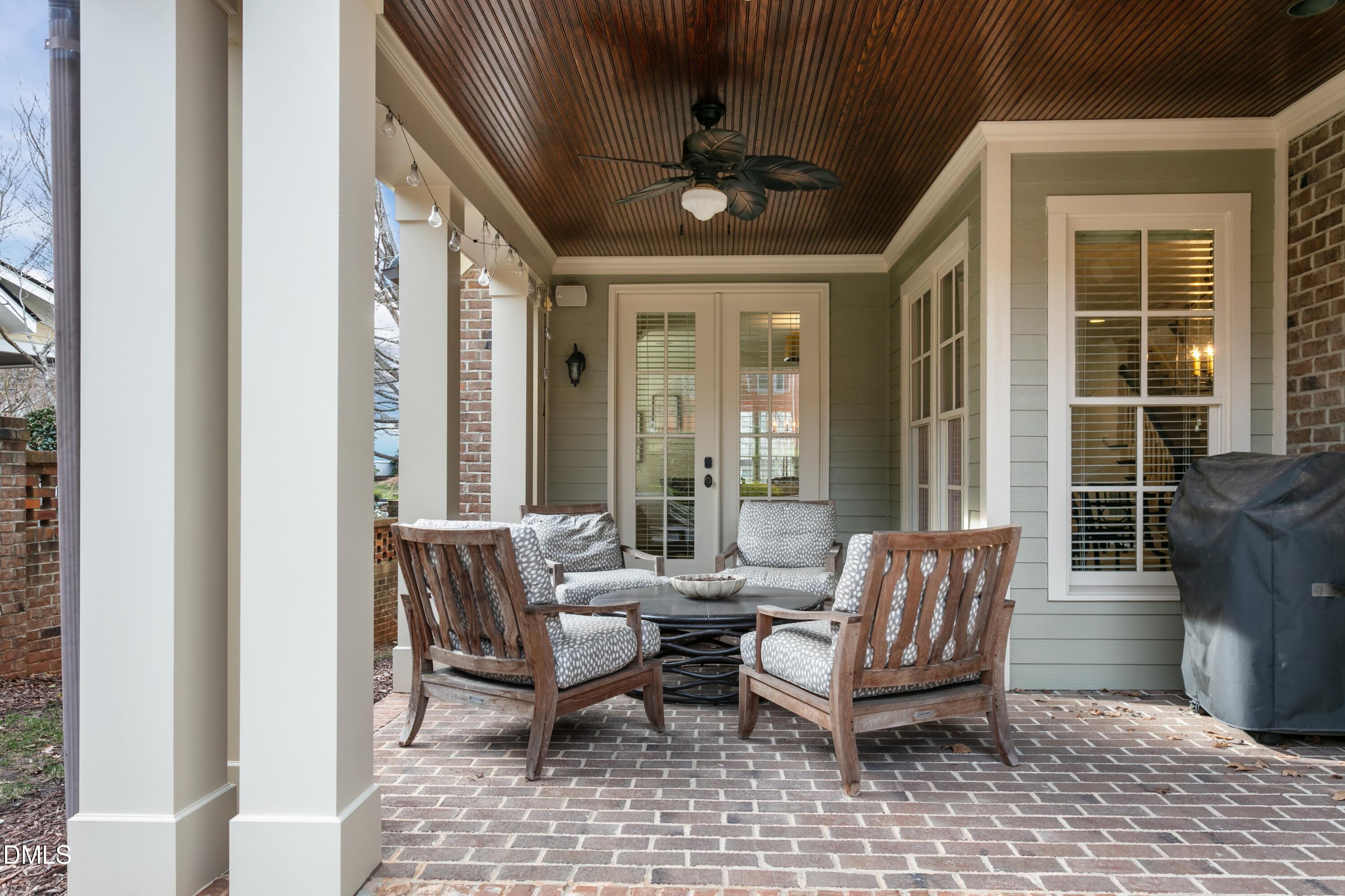 514 Wayne Drive Raleigh, NC 27608 - Photo 36 of 53 a outdoor space with patio the couches and a dining table with garden view