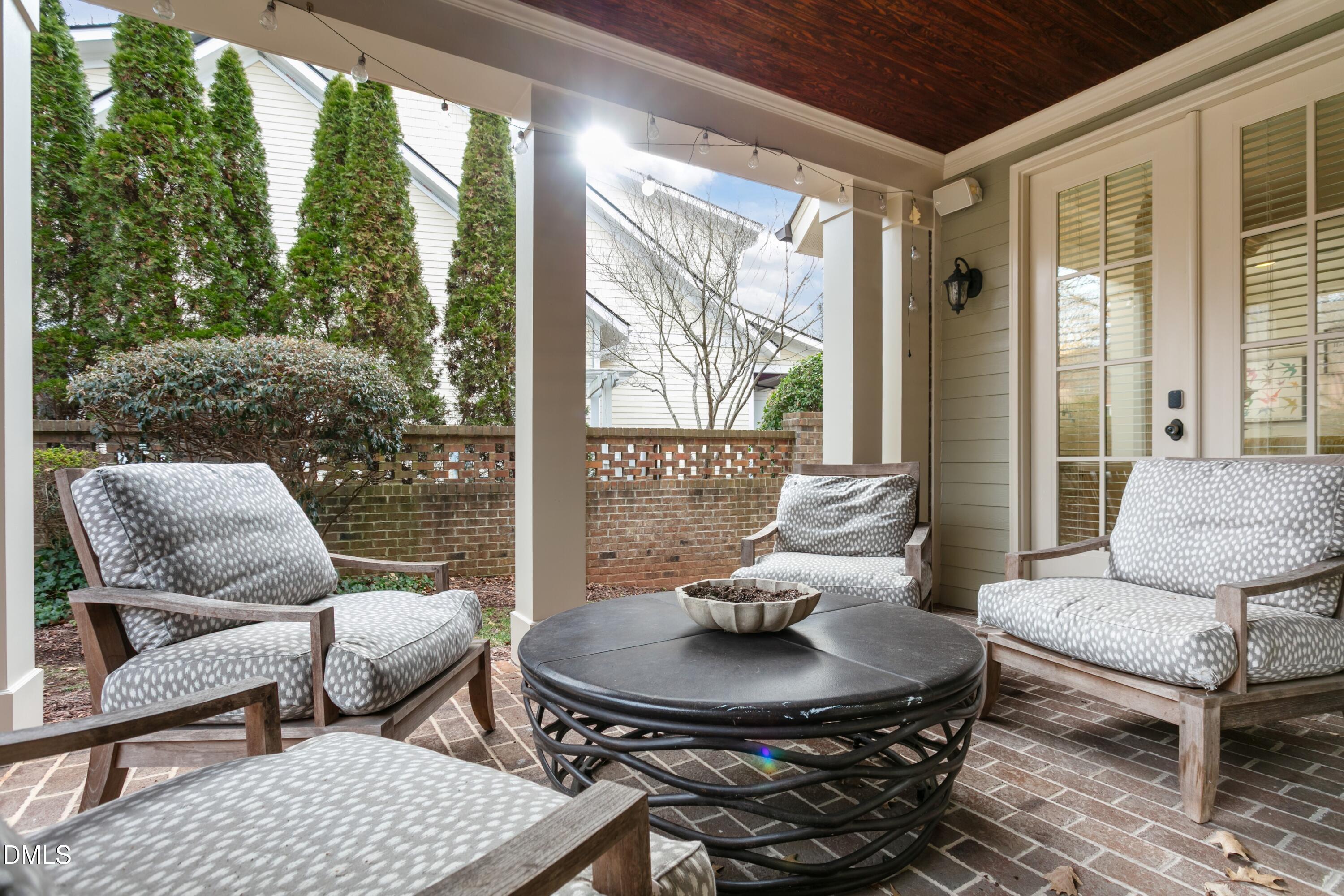 514 Wayne Drive Raleigh, NC 27608 - Photo 39 of 53 a living room with furniture and a floor to ceiling window