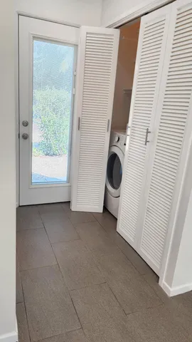 a view of a storage & utility room with a window