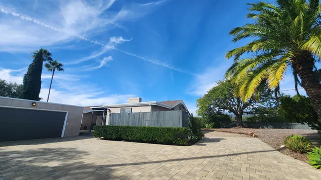 a view of a house with a street