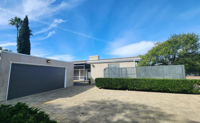 a view of backyard with a garden and plants
