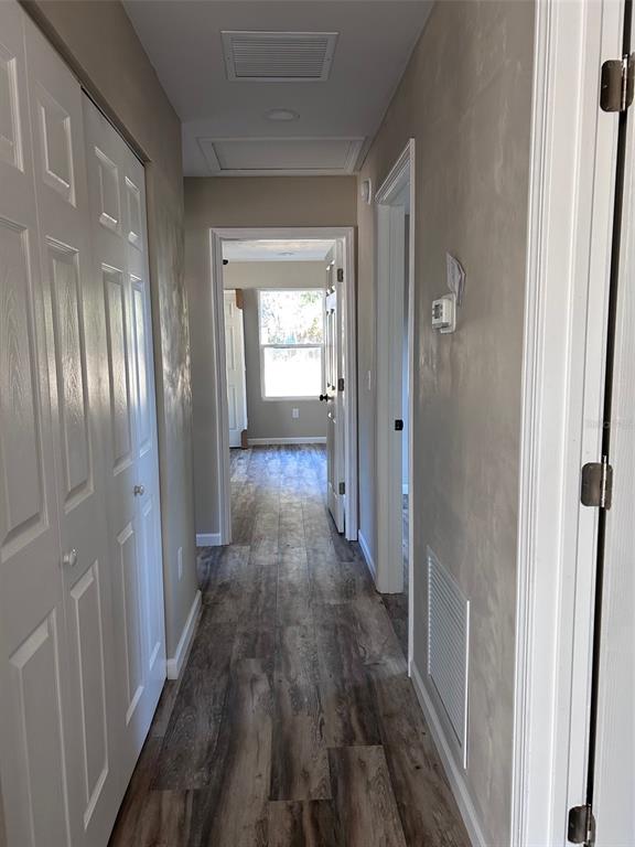 570 Southwest 5th Street Lake Butler, FL 32054 - Photo 3 of 11 a view of a hallway with wooden floor