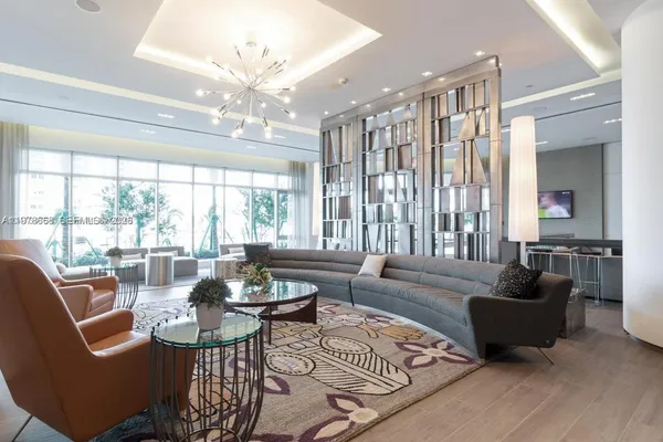 a dining room with furniture window and entryway