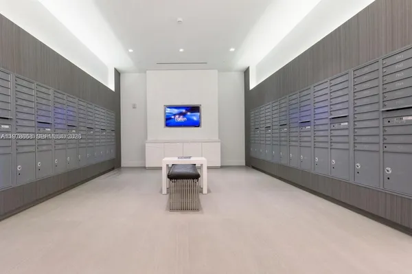 a living room with furniture and a chair
