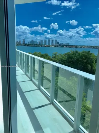 a view of a balcony with an ocean view