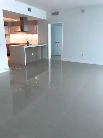 a room with cabinets and window