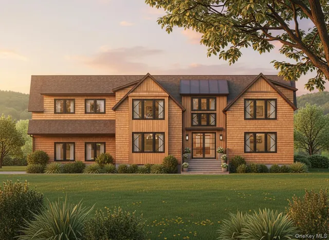 a front view of a house with a garden