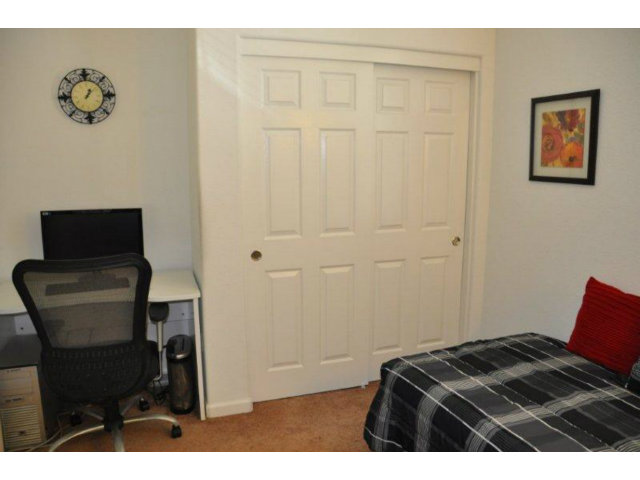 1797 Snell Place Milpitas, CA 95035 - Photo 14 of 25 a bedroom with a bed and a chair