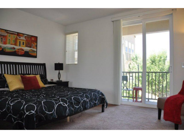 1797 Snell Place Milpitas, CA 95035 - Photo 16 of 25 a bedroom with a bed next to a window