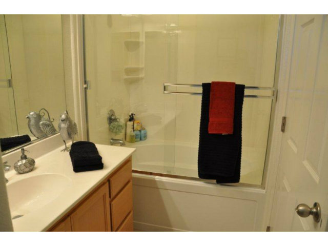 1797 Snell Place Milpitas, CA 95035 - Photo 17 of 25 a bathroom with a sink and a mirror