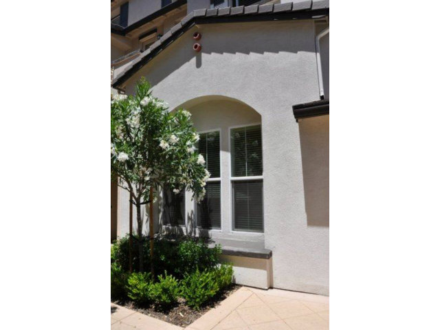 1797 Snell Place Milpitas, CA 95035 - Photo 2 of 25 a front view of a house with plants