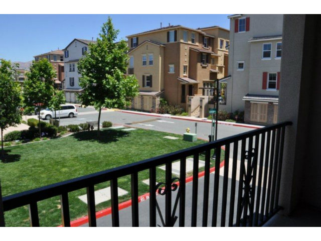 1797 Snell Place Milpitas, CA 95035 - Photo 22 of 25 a view of a brick house with a large trees