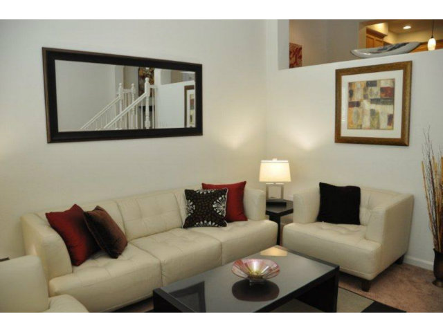 1797 Snell Place Milpitas, CA 95035 - Photo 4 of 25 a living room with furniture and a wall painting