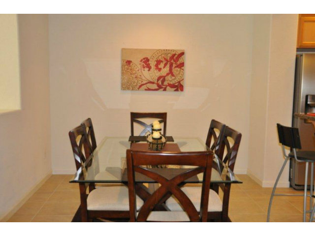 1797 Snell Place Milpitas, CA 95035 - Photo 8 of 25 a view of a dining room with furniture and a potted plant