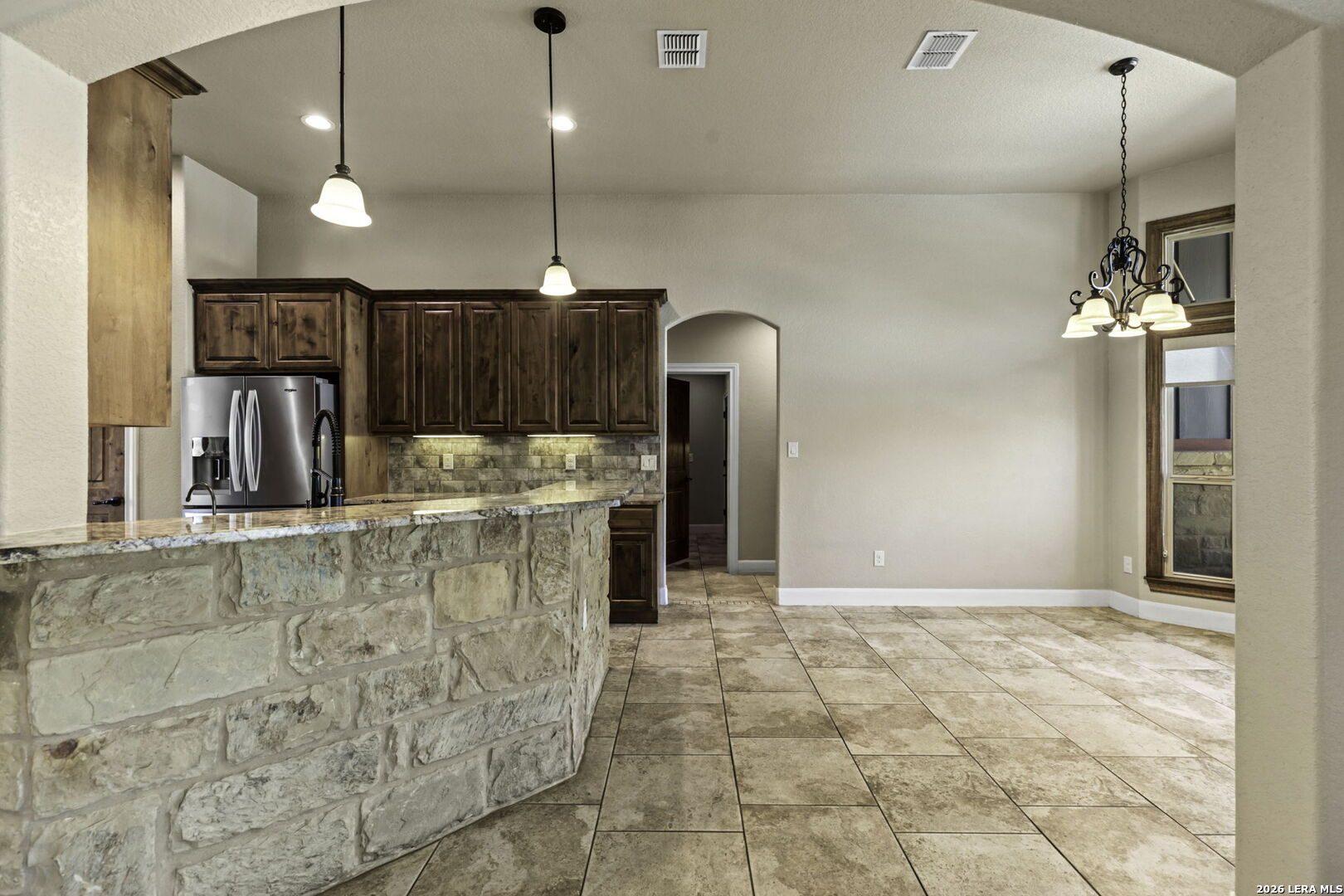 520 Arbor View Adkins, TX 78101 - Photo 12 of 32 a view of a kitchen with a sink and chandelier