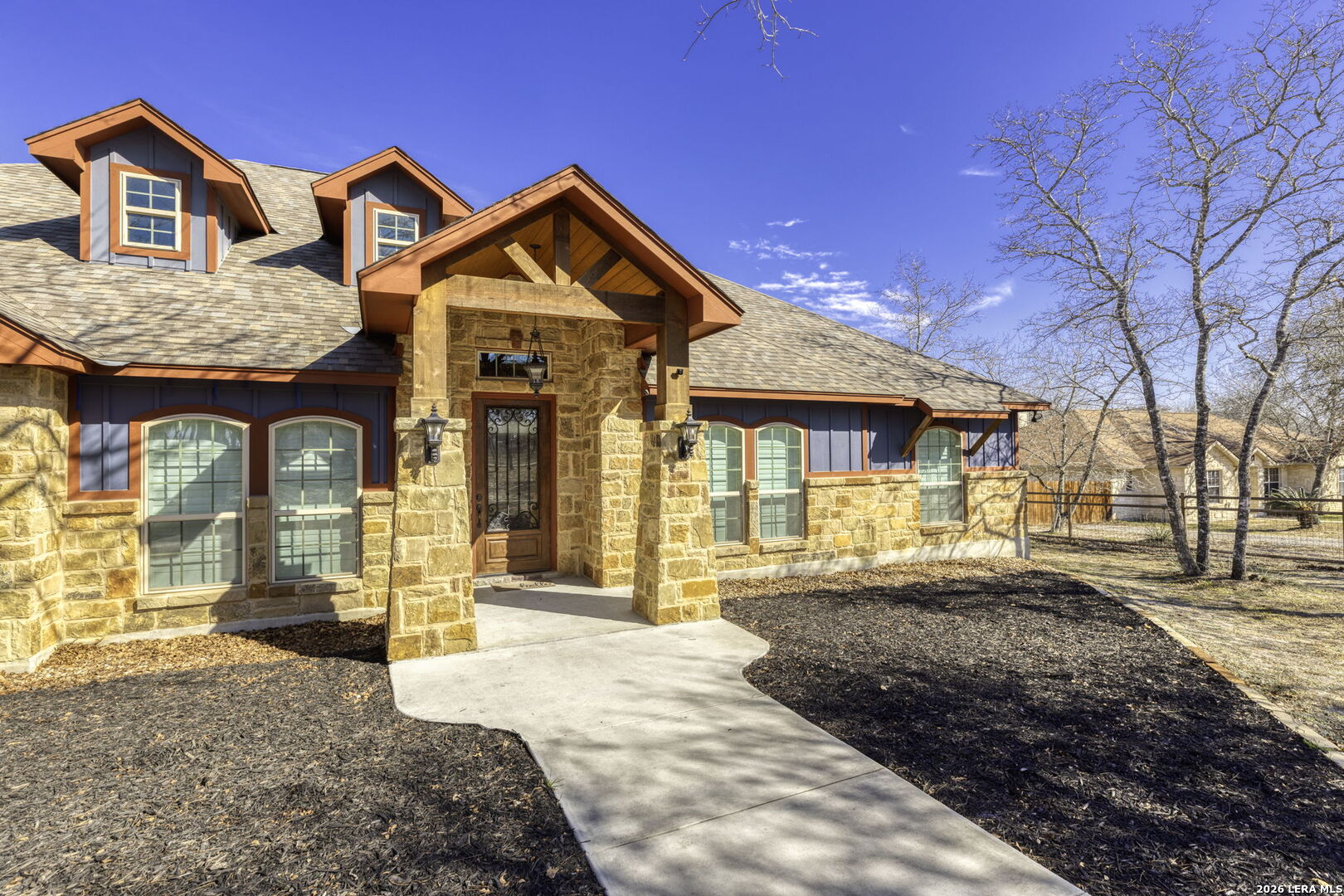 520 Arbor View Adkins, TX 78101 - Photo 5 of 32 a front view of a house with a yard