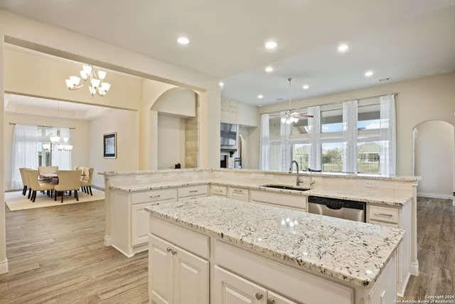 a view of living room with granite countertop furniture and fireplace
