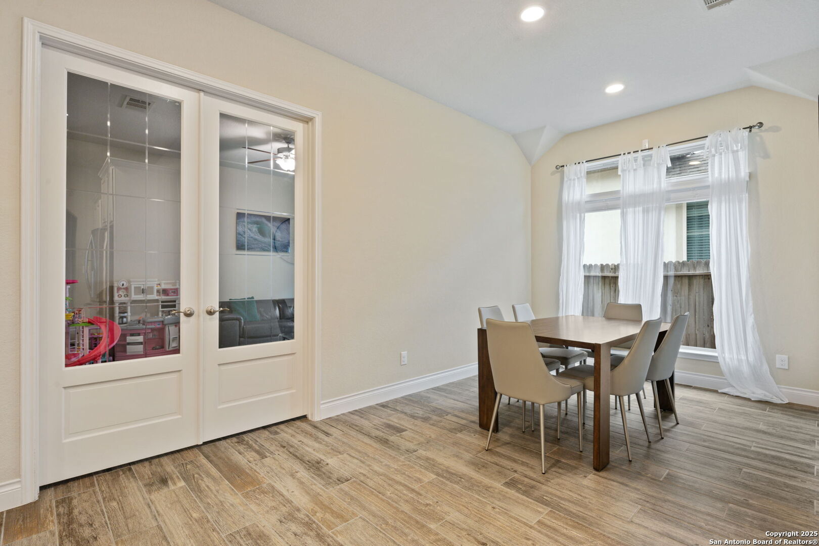 7938 Cibolo Boerne, TX 78015 - Photo 16 of 37 a view of a dining room with furniture and wooden floor