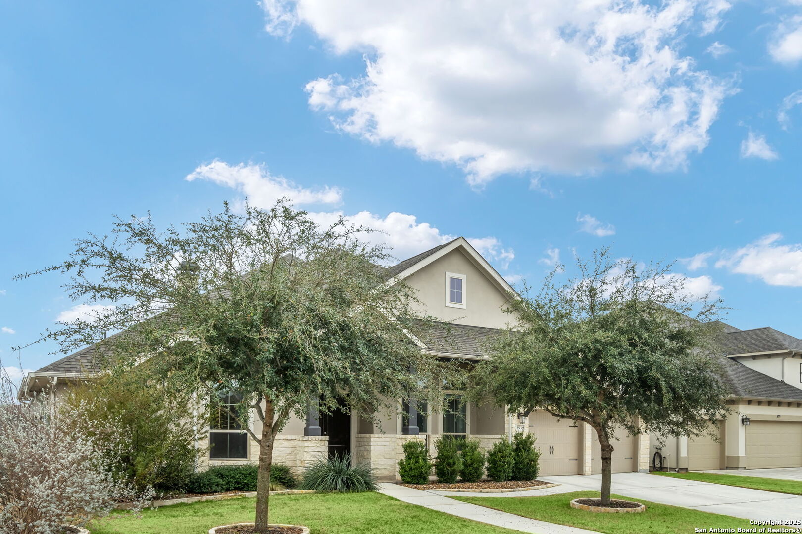 7938 Cibolo Boerne, TX 78015 - Photo 2 of 37 a view of a house with a yard and a fountain