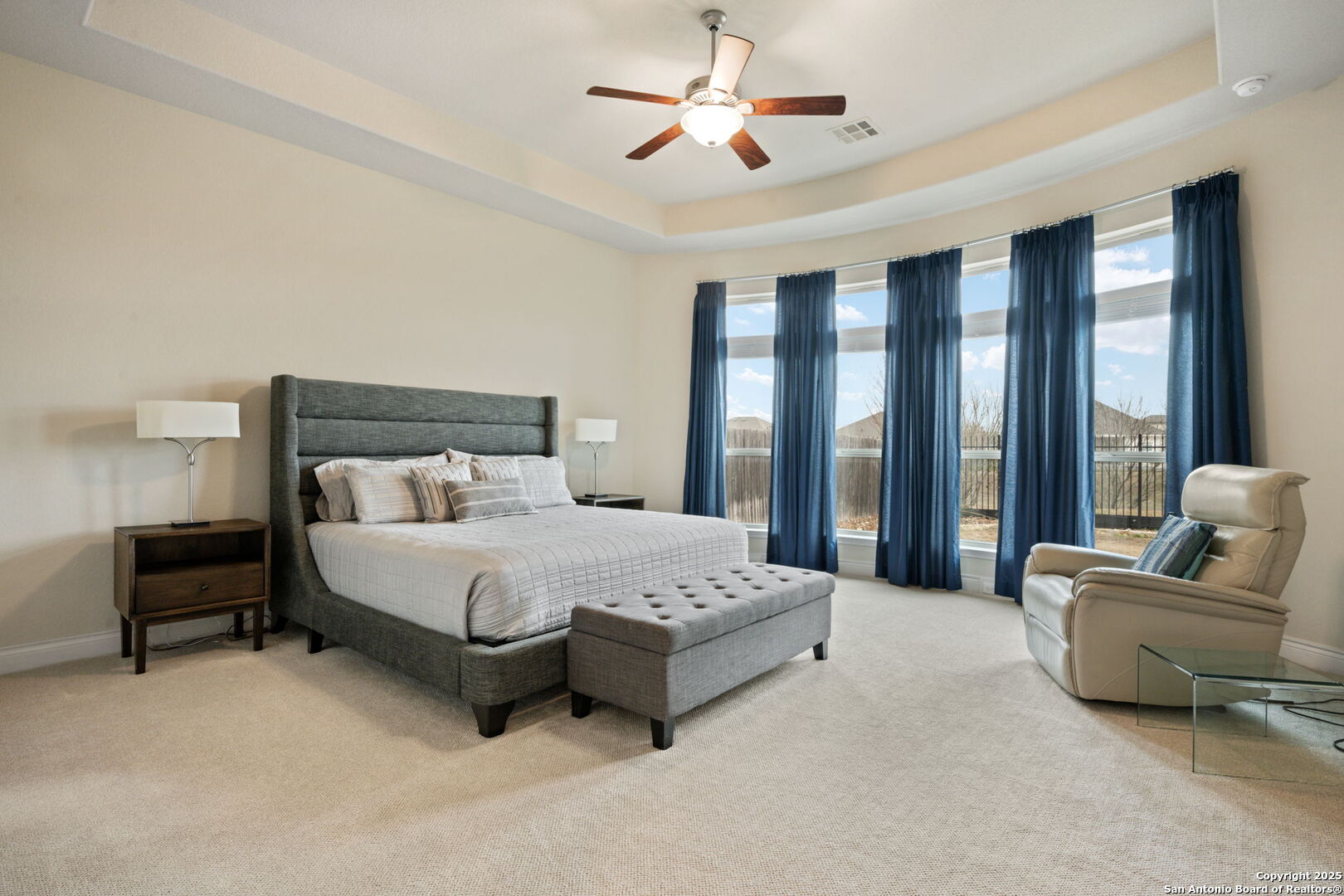 7938 Cibolo Boerne, TX 78015 - Photo 21 of 37 a spacious bedroom with a bed and a couch