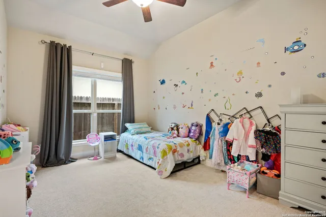 a bedroom with furniture and a bed