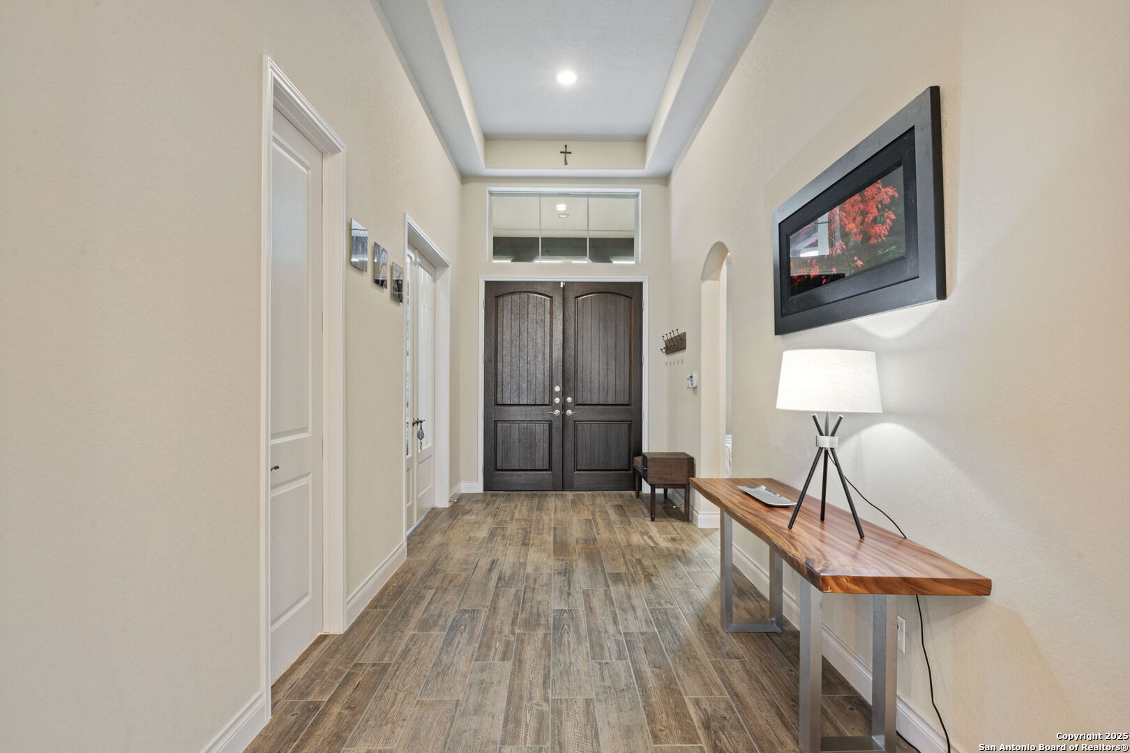 7938 Cibolo Boerne, TX 78015 - Photo 4 of 37 a view of a hallway with wooden floor and staircase