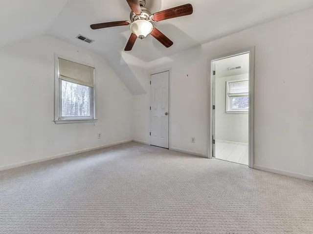a bathroom with a sink a large mirror and a bathtub