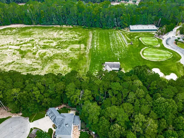 an aerial view of a house with a garden
