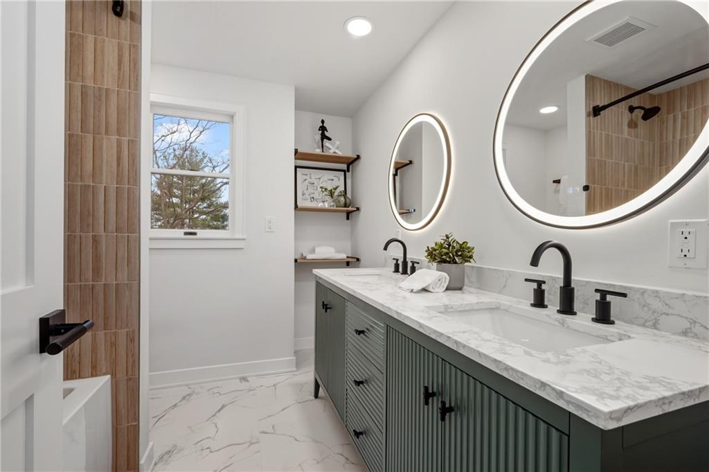 107 Marlboro Road Pittsburgh, PA 15238 - Photo 25 of 45 a bathroom with a double vanity sink and a mirror
