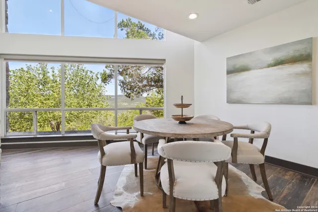 a spacious bathroom with a sink and a mirror