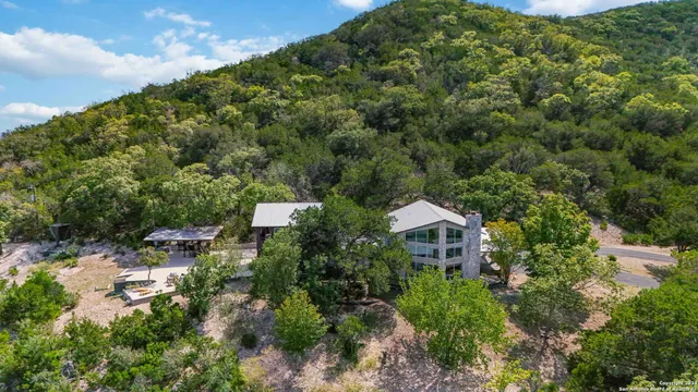 an aerial view of residential houses with outdoor space