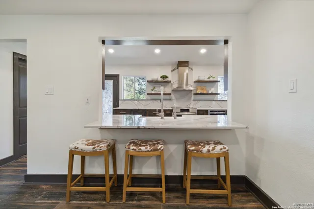 a view of two chairs in the balcony