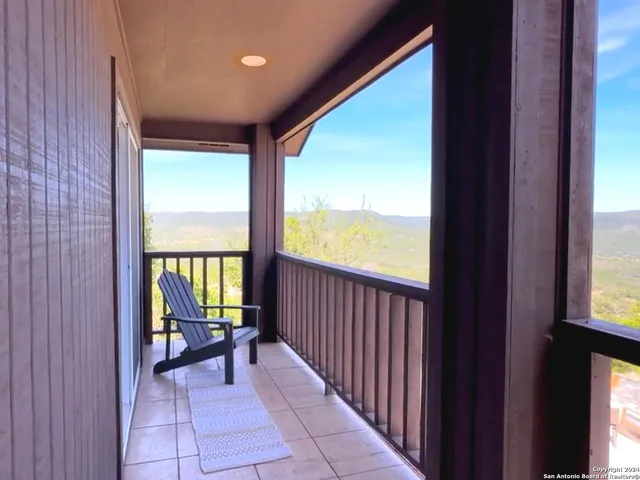 an aerial view of a house with yard and outdoor seating