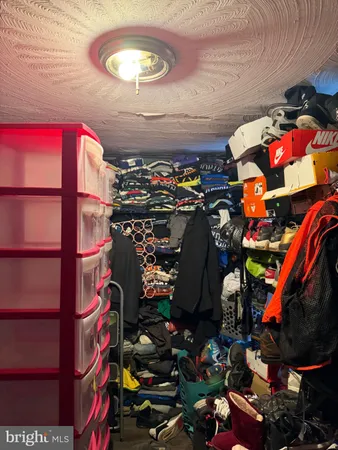 a living room with lots of furniture and lamp