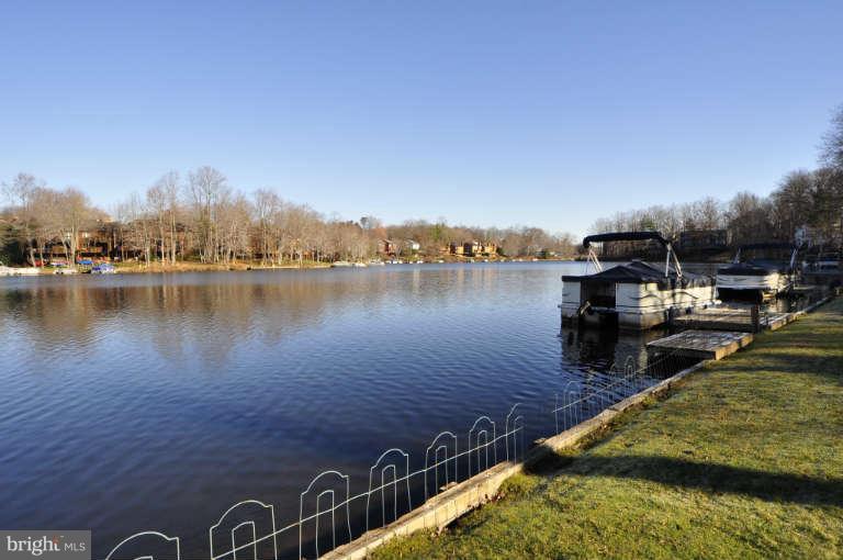 2260 Compass Point Lane Reston, VA 20191 - Photo 21 of 23 a view of a lake with houses