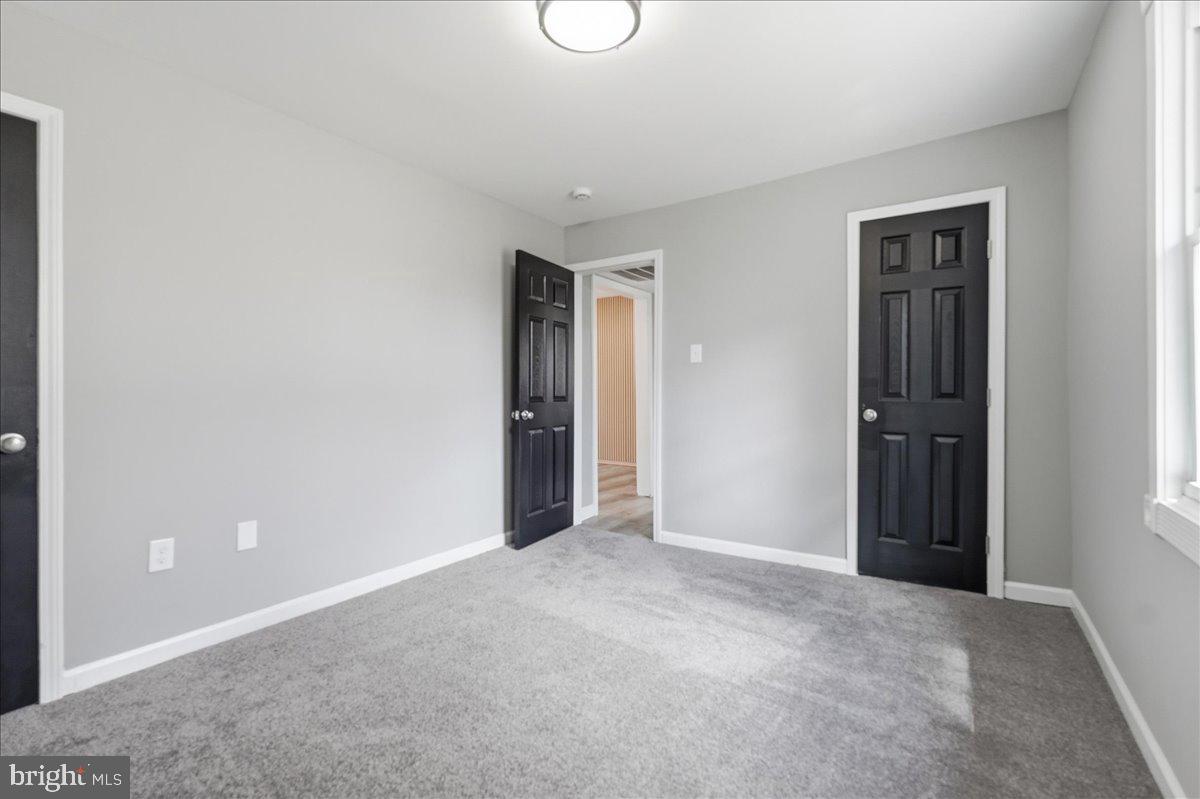 15924 Dusty Lane Accokeek, MD 20607 - Photo 13 of 22 an empty room with windows and bathroom