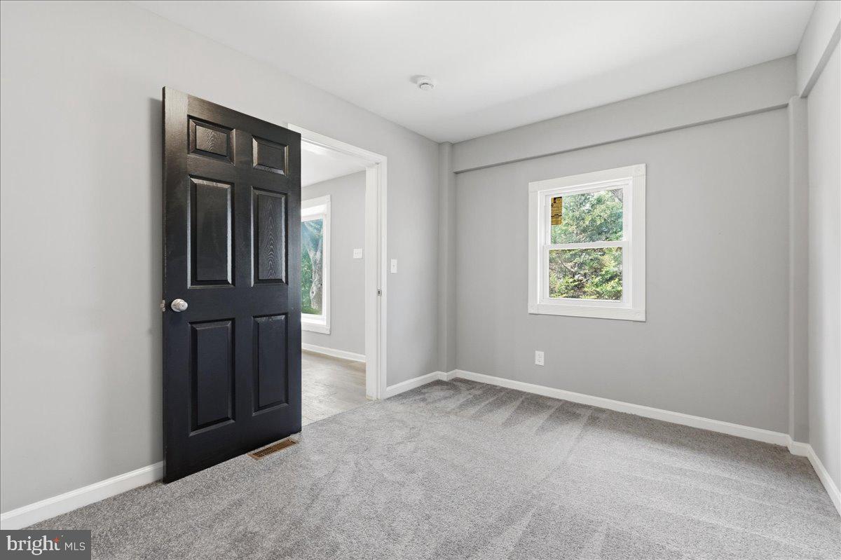 15924 Dusty Lane Accokeek, MD 20607 - Photo 16 of 22 an empty room with windows