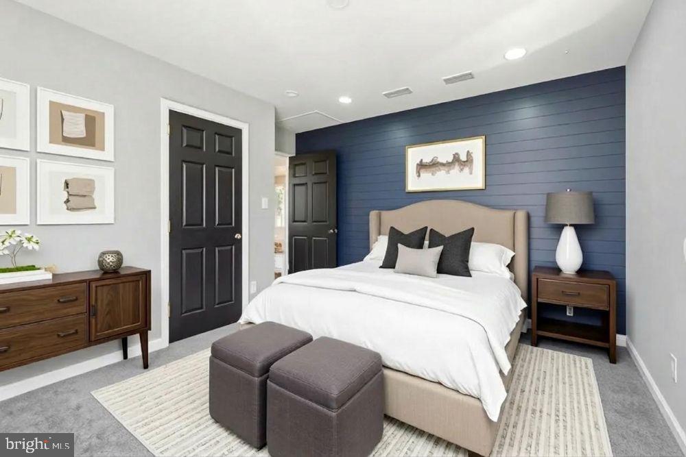 15924 Dusty Lane Accokeek, MD 20607 - Photo 6 of 22 a spacious bedroom with a bed and a couch