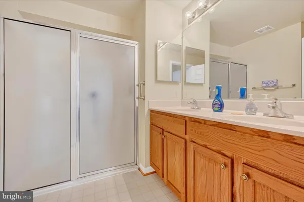 a bathroom with a sink and mirror