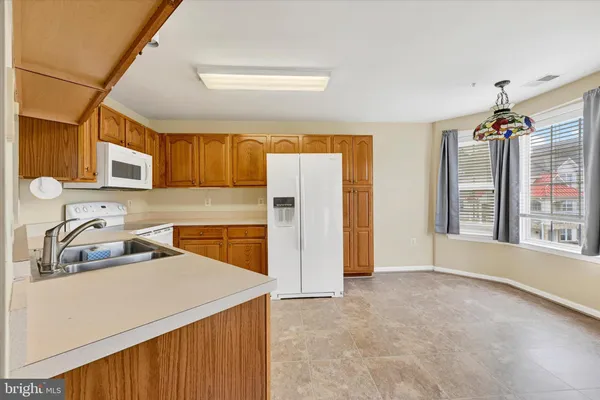 a kitchen that has a cabinets and a stove