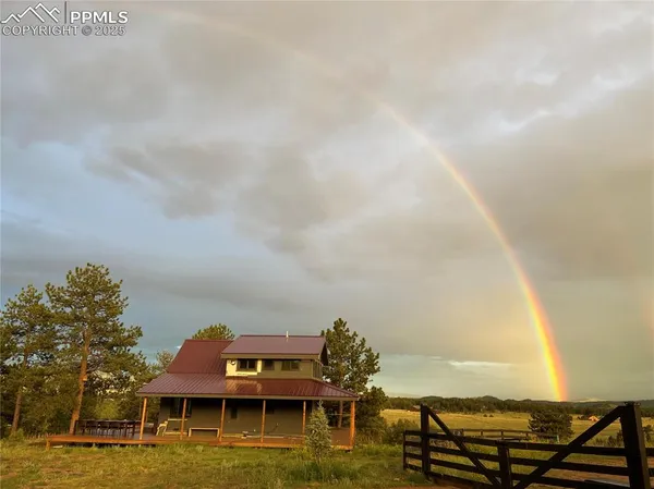 a roof deck with table and chairs a barbeque with wooden floor