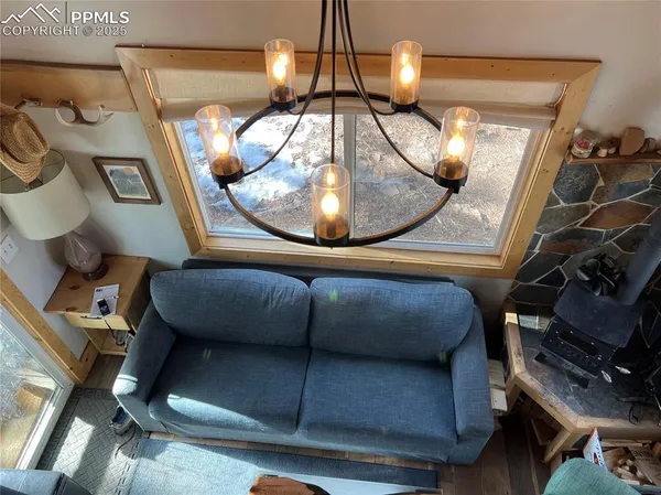 a view of living room with furniture and chandelier