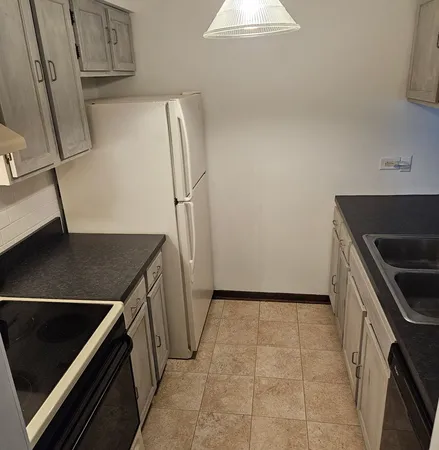 storage and utility room with washer and dryer