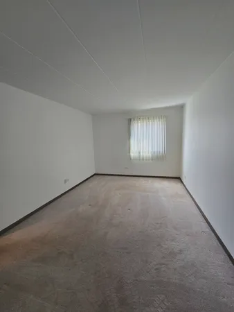 an empty room with a window