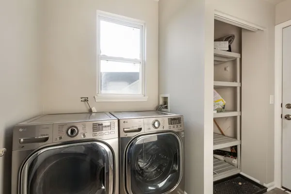 a view of a storage & utility room with a washer and dryer