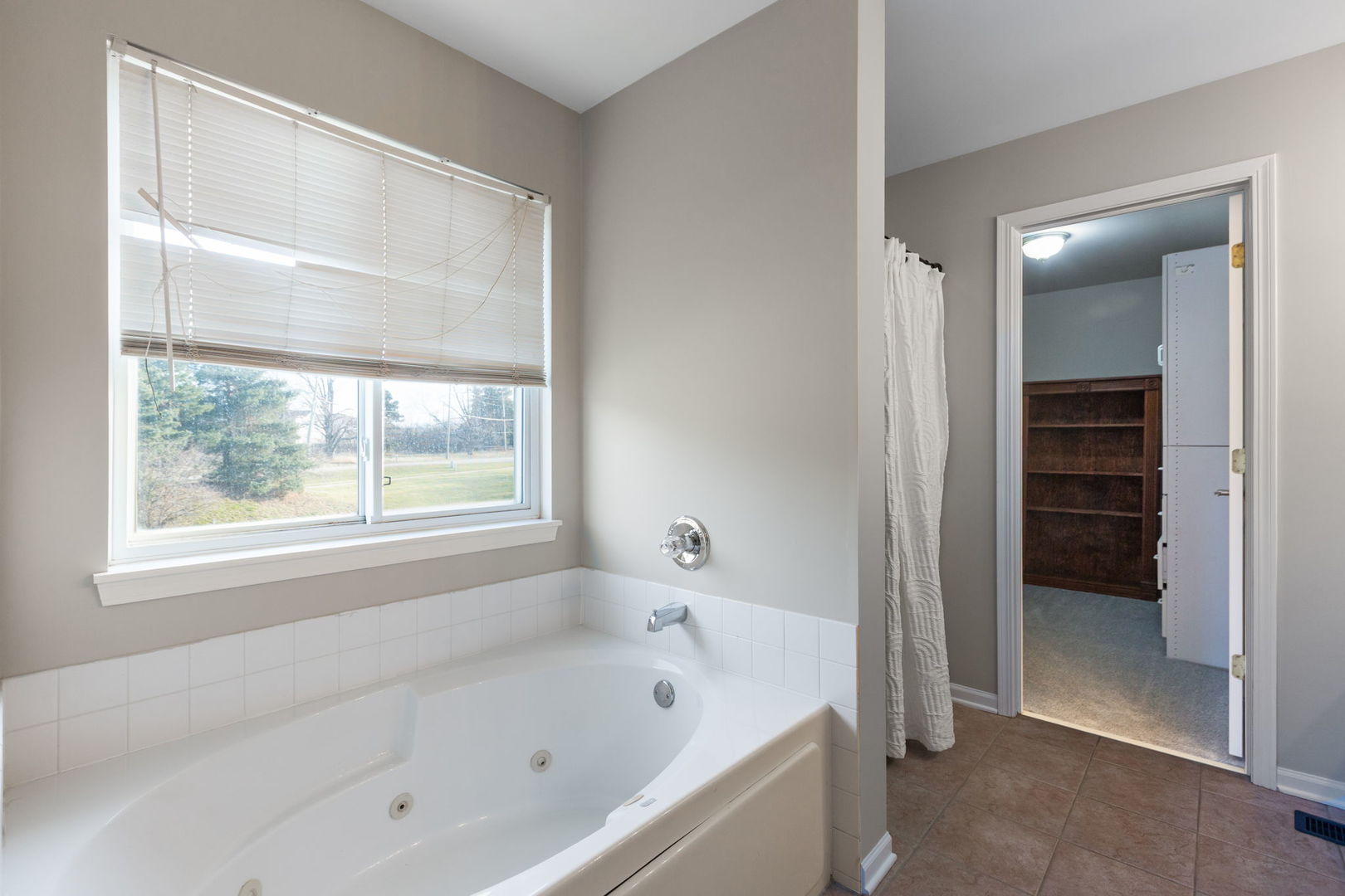 2020 Spring Creek Lane McHenry, IL 60050 - Photo 10 of 17 a bathroom with a bathtub and a shower